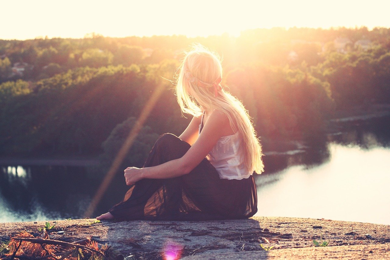 young woman, sitting, overlooking